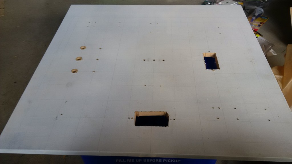 Toddler Activity Board - Primed with the grid layout and holes cut